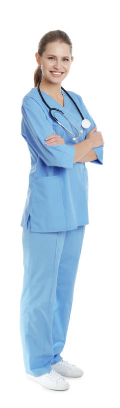 Photo of a young medical professional in scrubs on a white background. Her arms are folded over her chest and she is smiling at the viewer.